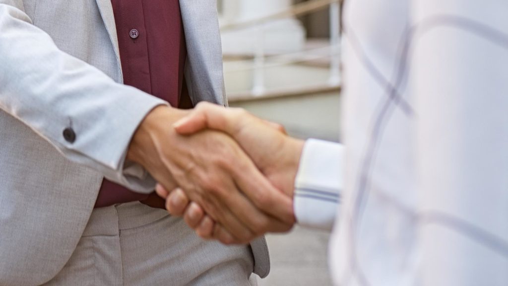 concierge medicine | woman shaking hands with someone
